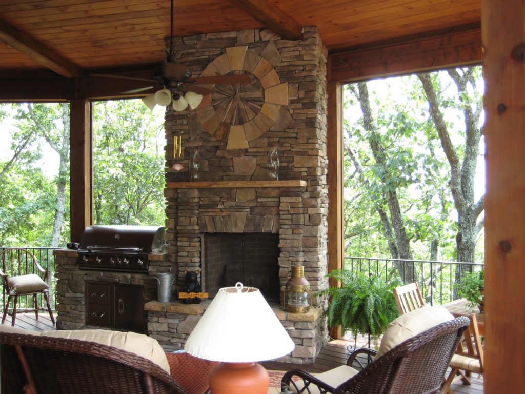 A creative deck with features like a grill and fireplace from an Atlanta contractor