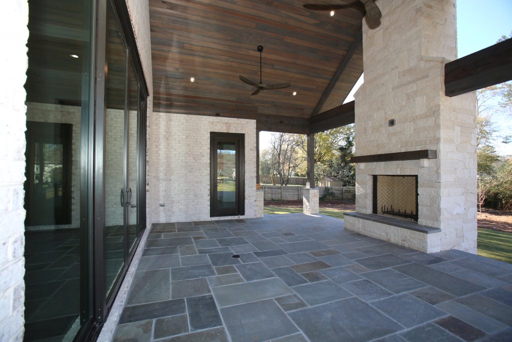 covered patio remodel with fireplace