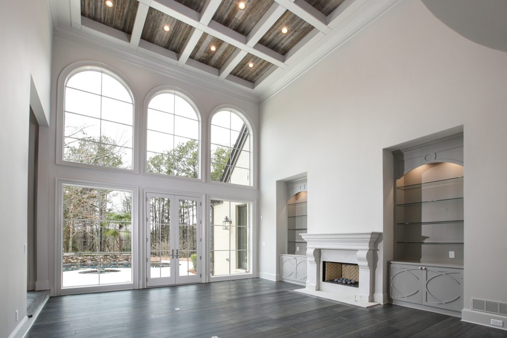 Pricing a custom home remodel, like this sunroom with built-ins and fireplace, is easy