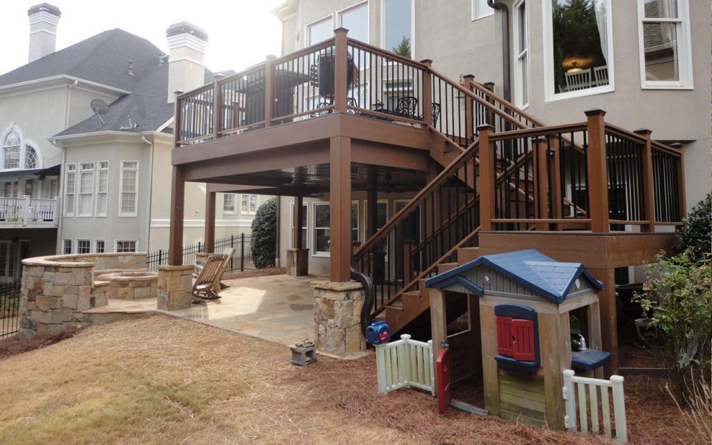 Norm Hughes Outdoor Deck with fire pit and playhouse