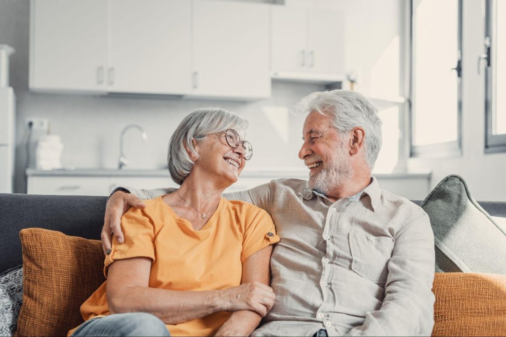 Elderly couple sitting on couch ©Perfect Wave