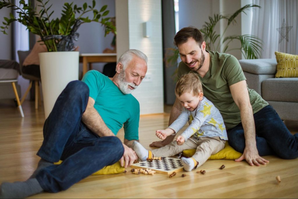 Three Generations of Men Playing a Game of Chess ©Mladen Zivkovic